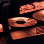 Dynamic close-up shot of illuminated gaming graphics card fans in red light, showcasing cutting-edge technology.