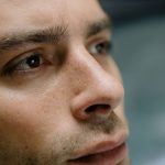 Detailed close-up portrait focusing on a man's facial features and skin texture.