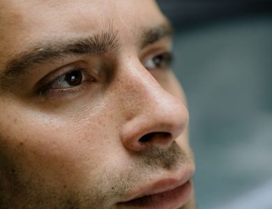 Detailed close-up portrait focusing on a man's facial features and skin texture.
