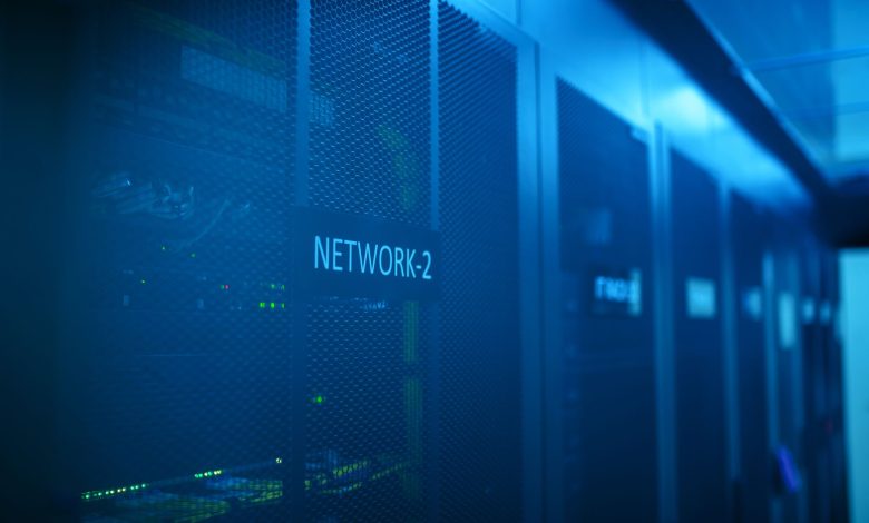 A modern server room featuring network equipment with blue illumination. Ideal for technology themes.