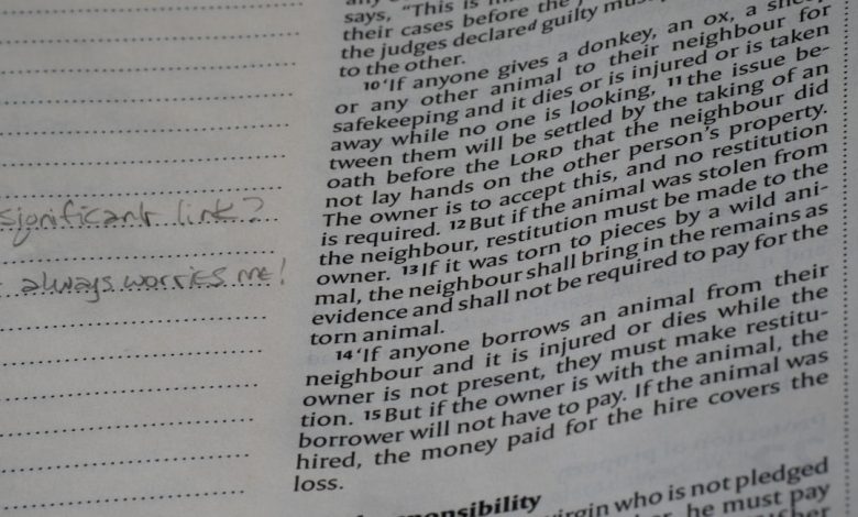 Close-up of a page from a book with handwritten notes.