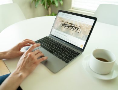 black and gray laptop beside teacup