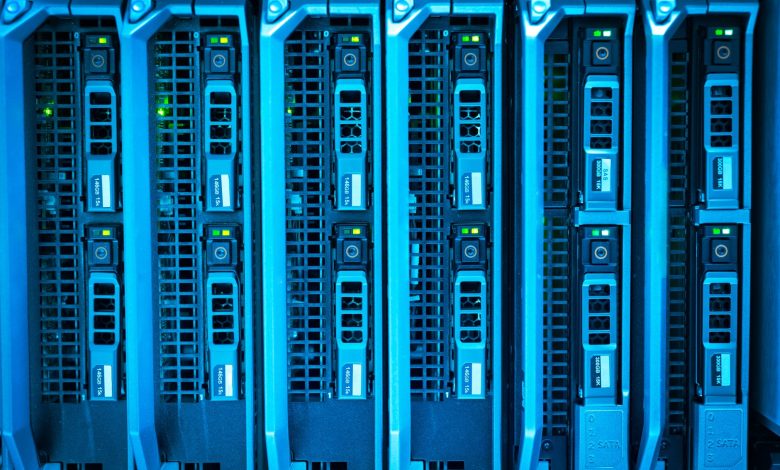 Detailed image of illuminated server racks showcasing modern technology infrastructure.