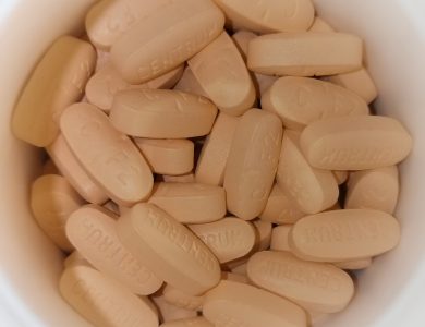 Multivitamin tablets shown together on a neutral surface.
